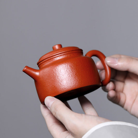 De Zhong – Pear-Skin Vermilion Zisha Teapot (Handmade by Li Xinsheng)